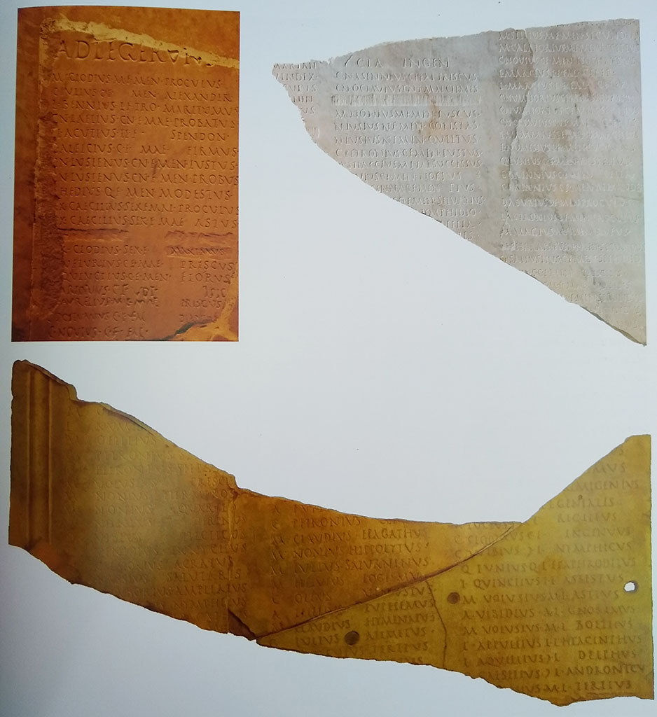 VII.16 Herculaneum. Detail from Great Album of Names, originally discovered 24th/26th May 1739.
Top left is a fragment discovered in the eighteenth century; two new fragments found in 1961 are top right.
Below is a join between an old and a new fragment. Photo courtesy of Prof. Andrew Wallace-Hadrill.
Now in Naples Archaeological Museum. Inventory numbers 3728, 3729.
See Wallace-Hadrill, A. (2011). Herculaneum, Past and Future. London, Frances Lincoln Ltd, (p.139).
According to Wallace-Hadrill –
“Numerous fragments with names carefully cut into handsome white marble slabs, emerged from the earliest Bourbon excavations on
26th May and 1st July 1739. Because at the time there were two excavations, at the Theatre and at the ‘new excavations’ (“nuevas grutus” in Spanish) near Via Mare, there was continuous confusion over what came from where, and it was long believed they came from the Theatre.
Only when, at the end of his career, Amedeo Maiuri was exploring the area of the Basilica did three new fragments emerge, one of which matches perfectly an old fragment.”
See Wallace-Hadrill, A. (2011). Herculaneum, Past and Future. London, Frances Lincoln Ltd, (p.138).